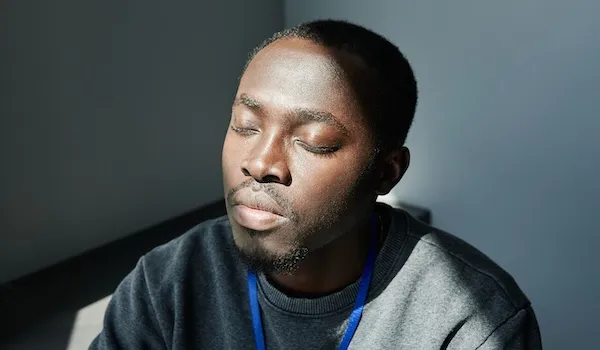 somatic therapy partners man looking calm with sun on his face man looking calm with sun on his face