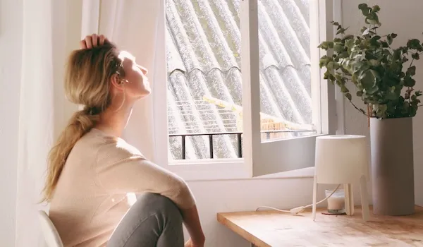 somatic therapy partners woman looking out of window woman looking out of window